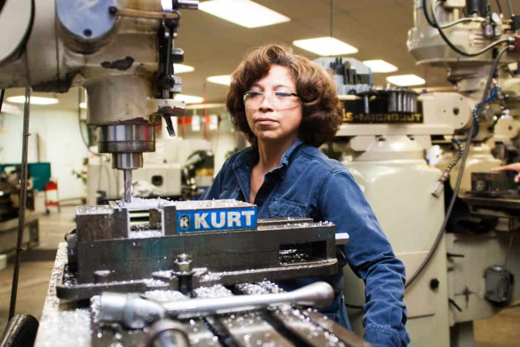 Woman working in machine shop