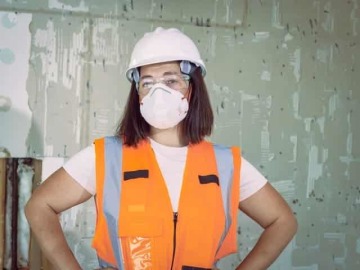 Woman in proper fitted PPE