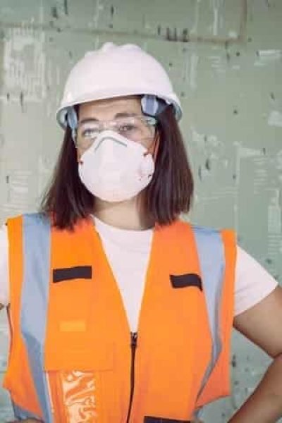 Woman in proper fitted PPE